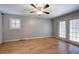 Inviting living room with hardwood floors, shuttered windows, and a ceiling fan at 224 E Felton Rd, Cartersville, GA 30121