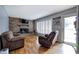 Living room featuring hardwood floors, a brick fireplace and neutral paint at 224 E Felton Rd, Cartersville, GA 30121