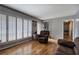 Comfortable living room with hardwood floors, shutters, and open access to entryway at 224 E Felton Rd, Cartersville, GA 30121