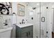 Bathroom featuring a glass shower, granite countertop, modern fixtures, and neutral paint at 2316 Miriam Ln, Decatur, GA 30032