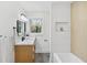 Modern bathroom featuring a soaking tub and shower with gray tile floors at 2316 Miriam Ln, Decatur, GA 30032