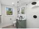 Bathroom featuring a glass shower, stylish vanity, modern fixtures, and a bright window at 2316 Miriam Ln, Decatur, GA 30032