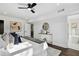 Bright bedroom featuring a ceiling fan, modern furniture and decor with a peek of the bathroom at 2316 Miriam Ln, Decatur, GA 30032