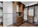 Walk-in closet with custom shelving and drawers with wood floor at 2316 Miriam Ln, Decatur, GA 30032