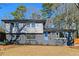 The charming renovated two-story home has a freshly painted exterior, landscaped yard and new windows at 2316 Miriam Ln, Decatur, GA 30032