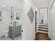 Hallway with a sleek glass shower enclosure and gray tiled bathroom at 2316 Miriam Ln, Decatur, GA 30032