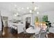 Modern kitchen with white cabinets, stainless steel appliances, and a large island at 2316 Miriam Ln, Decatur, GA 30032