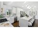 Modern kitchen featuring an island with seating, stainless appliances and sleek white cabinetry at 2316 Miriam Ln, Decatur, GA 30032