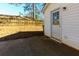 Backyard featuring a concrete patio, white siding, and a wooden fence at 2775 Capri Dr, Cumming, GA 30041