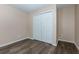 Clean bedroom featuring hardwood floors and a double door closet at 2775 Capri Dr, Cumming, GA 30041