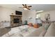 Inviting living room features a stone fireplace, ceiling fan, and stylish furniture at 2775 Capri Dr, Cumming, GA 30041
