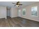 Spacious living room with hardwood floors, large windows and neutral paint at 2775 Capri Dr, Cumming, GA 30041