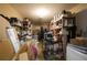 Cluttered basement featuring concrete floors, exposed ceiling, and walls lined with shelving at 2800 Barnwood Xing, Duluth, GA 30097