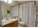 Standard bathroom with single vanity and patterned shower curtain at 2800 Barnwood Xing, Duluth, GA 30097