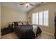 Bedroom with vaulted ceiling, window with shutters, and dark bedding at 2800 Barnwood Xing, Duluth, GA 30097