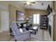 Comfortable living room featuring wood floors, neutral walls, a fireplace, and stylish decor at 2800 Barnwood Xing, Duluth, GA 30097