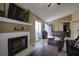 Cozy living room showcasing a fireplace, hardwood floors, and access to the outdoor patio at 2800 Barnwood Xing, Duluth, GA 30097