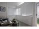 Bright sunroom with tiled floor, white walls, lots of windows, and comfortable seating at 2800 Barnwood Xing, Duluth, GA 30097