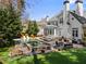 Beautiful backyard with a sparkling pool, hot tub, patio seating, and manicured lawn, ideal for relaxation at 65 Gatewood Dr, Marietta, GA 30068