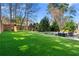 Lush backyard featuring artificial turf, a playset, and manicured landscaping for Gathering fun and outdoor activities at 65 Gatewood Dr, Marietta, GA 30068