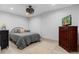 A well-lit bedroom featuring a queen-size bed, dresser, and neutral decor for a calm and inviting atmosphere at 65 Gatewood Dr, Marietta, GA 30068