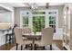 Breakfast nook with wooden ceiling beams, hardwood floors, and view of the backyard at 65 Gatewood Dr, Marietta, GA 30068