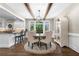 Charming breakfast nook with exposed wood beams, hardwood floors, and backyard views at 65 Gatewood Dr, Marietta, GA 30068