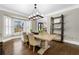 Dining room with hardwood floors, bay windows, and a large wood table with seating for six at 65 Gatewood Dr, Marietta, GA 30068