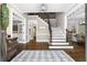 Bright foyer with hardwood floors, staircase with iron spindles, and classic trim at 65 Gatewood Dr, Marietta, GA 30068