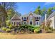 Beautiful two story brick home with mature landscaping and a manicured lawn at 65 Gatewood Dr, Marietta, GA 30068