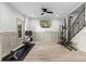 Bright gym featuring an elliptical machine, rowing machine, mounted TV, and a ceiling fan at 65 Gatewood Dr, Marietta, GA 30068