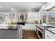 Bright, updated kitchen with granite countertops, stainless steel appliances, and hardwood floors at 65 Gatewood Dr, Marietta, GA 30068