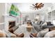 Bright, open living room featuring hardwood floors, a fireplace, and seamless access to adjacent rooms at 65 Gatewood Dr, Marietta, GA 30068