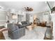 Bright living room with built-in shelves, ceiling fan, neutral colors, and hardwood flooring at 65 Gatewood Dr, Marietta, GA 30068