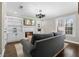 Cozy living room features built-in bookshelves, fireplace, hardwood floors, and plantation shutters at 65 Gatewood Dr, Marietta, GA 30068