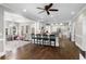 Large open concept living room with hardwood floors, natural light, and kitchen access at 65 Gatewood Dr, Marietta, GA 30068