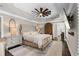Main bedroom features a tray ceiling, ceiling fan, and hardwood floors at 65 Gatewood Dr, Marietta, GA 30068