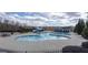 Large community pool with a slide and a separate pool area for the clubhouse at 2077 Towne Mill Ave, Canton, GA 30114