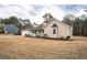 Inviting exterior view of a single Gathering home with a well-manicured lawn and attached garage at 220 Timber Ln, Stockbridge, GA 30281