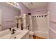 Cozy bathroom featuring a vanity with white marble countertop and shower with white tiling at 2382 Merrymount Dr, Suwanee, GA 30024