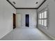 Bedroom with light colored walls and carpet with a set of shuttered windows at 2382 Merrymount Dr, Suwanee, GA 30024