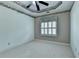 Neutral bedroom with a ceiling fan and a window providing natural light at 2382 Merrymount Dr, Suwanee, GA 30024
