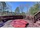 Wooden deck featuring a covered hot tub and scenic views at 2382 Merrymount Dr, Suwanee, GA 30024