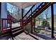 Multi-level deck with stairs leading down to the yard and a scenic view at 2382 Merrymount Dr, Suwanee, GA 30024