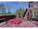 Wooden deck featuring a covered hot tub and scenic views at 2382 Merrymount Dr, Suwanee, GA 30024