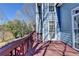 Exterior deck view overlooking the lake and well-manicured yard at 2382 Merrymount Dr, Suwanee, GA 30024