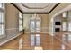 Formal dining room featuring hardwood floors, chandelier, and wainscoting, creating an elegant and inviting atmosphere for dining at 2382 Merrymount Dr, Suwanee, GA 30024