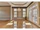 Formal dining room featuring hardwood floors, chandelier, and wainscoting, creating an elegant space for dining at 2382 Merrymount Dr, Suwanee, GA 30024