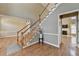 Spacious foyer with hardwood floors and a staircase leading to the upper level at 2382 Merrymount Dr, Suwanee, GA 30024