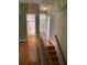 Hallway with hardwood floors and access to a bathroom at 2382 Merrymount Dr, Suwanee, GA 30024